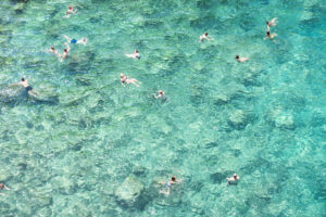 Swimming in the sea by photlovers