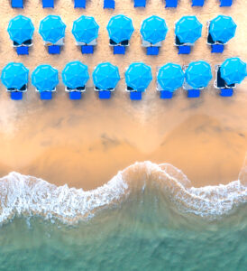 Aerial Blue Umbrellas Beach by Gilad Topaz